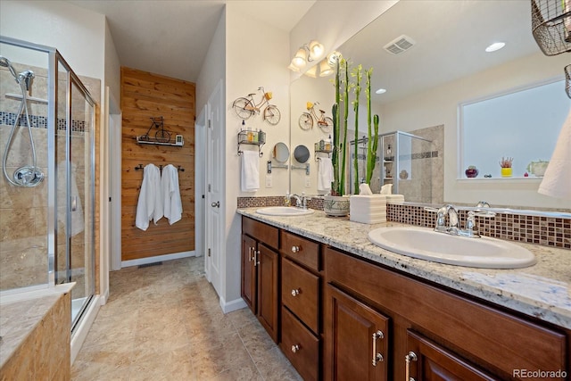 bathroom with vanity, wood walls, and an enclosed shower