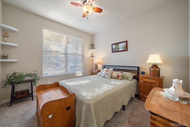 bedroom with ceiling fan and carpet