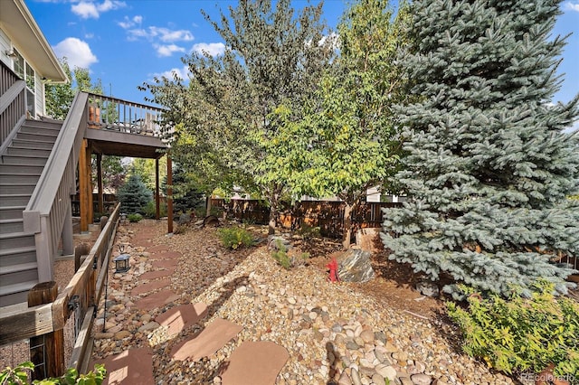 view of yard with a wooden deck