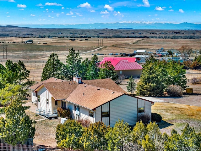 birds eye view of property featuring a mountain view and a rural view