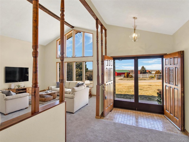 tiled foyer entrance featuring an inviting chandelier, beam ceiling, carpet floors, and high vaulted ceiling