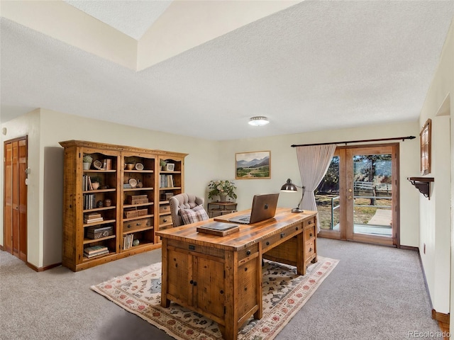 office featuring baseboards, light carpet, a textured ceiling, and french doors