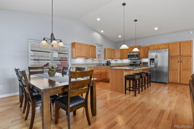 dining room featuring recessed lighting, baseboards, light wood-type flooring, and high vaulted ceiling