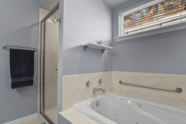 bathroom with a stall shower and a whirlpool tub