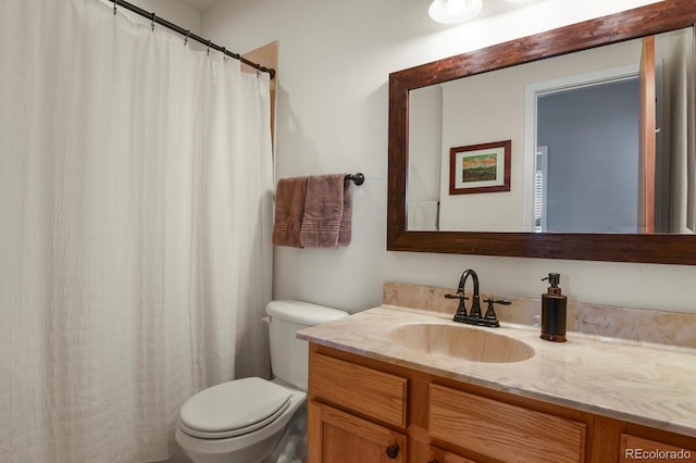 bathroom featuring toilet and vanity