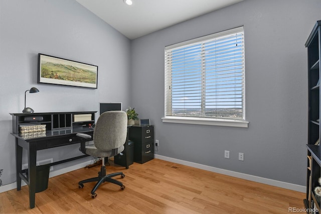 office with baseboards and wood finished floors