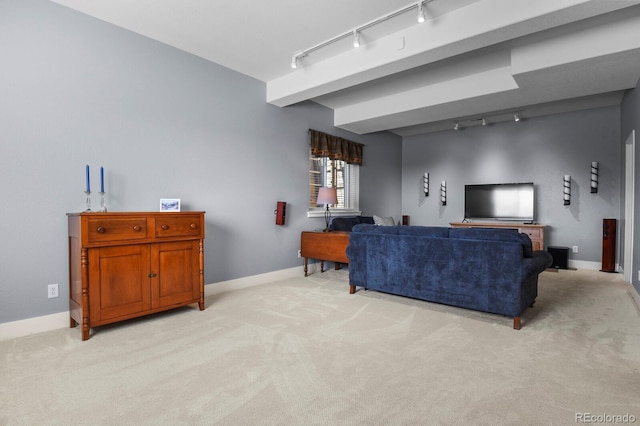 living area featuring baseboards, light colored carpet, and rail lighting