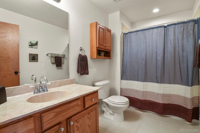 bathroom with tile patterned flooring, toilet, vanity, and a shower with curtain