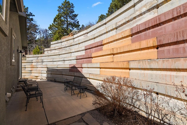 view of patio / terrace featuring fence