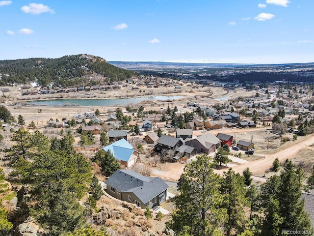 birds eye view of property with a residential view and a water view