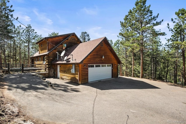view of side of property featuring a garage