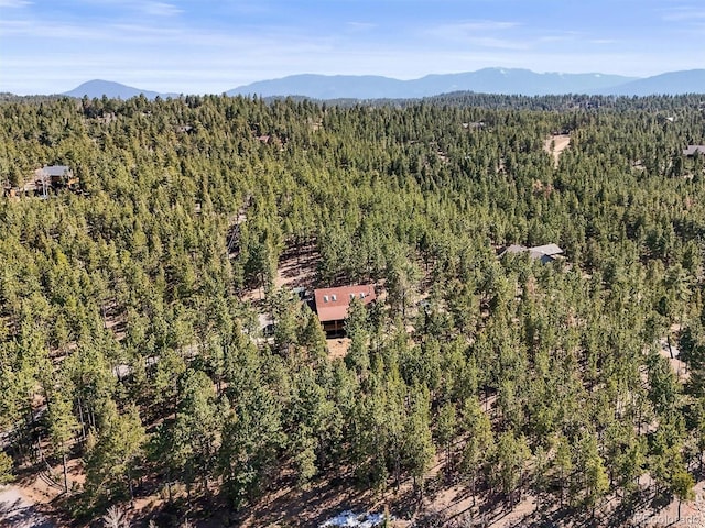 bird's eye view featuring a mountain view and a forest view