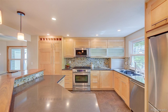 3966 Bosque Ct, Boulder, CO 80301 - kitchen featuring stainless steel appliances, light brown cabinetry, a sink, tasteful backsplash, and recessed lighting