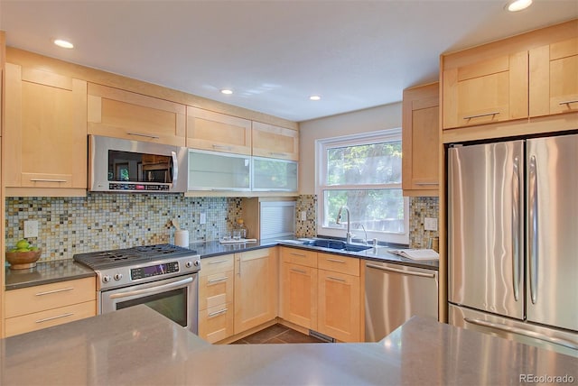 3966 Bosque Ct, Boulder, CO 80301 - kitchen with appliances with stainless steel finishes, light brown cabinets, a sink, tasteful backsplash, and recessed lighting