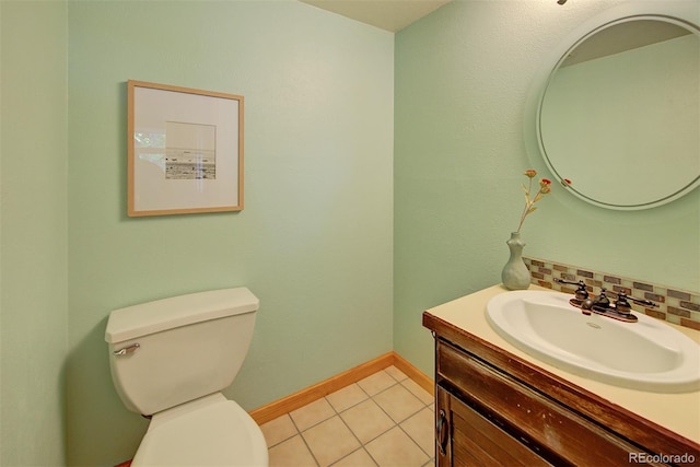 3966 Bosque Ct, Boulder, CO 80301 - half bathroom featuring vanity, toilet, tile patterned floors, and baseboards