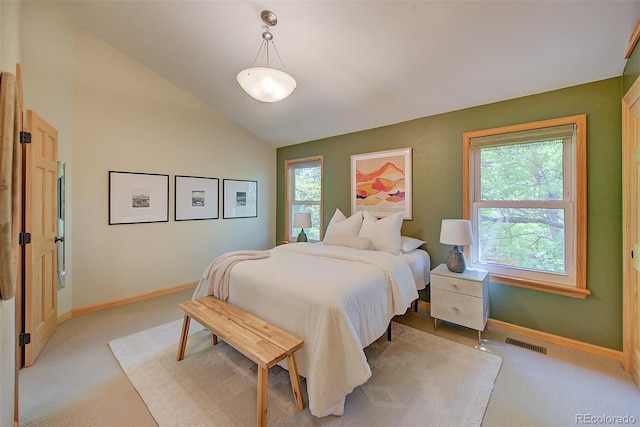 3966 Bosque Ct, Boulder, CO 80301 - bedroom featuring multiple windows, light carpet, baseboards, and lofted ceiling
