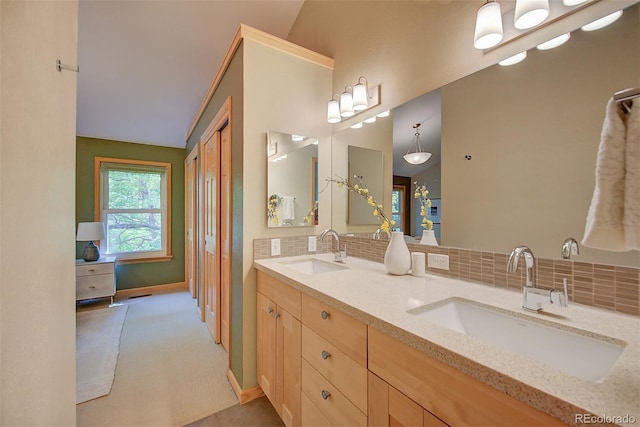3966 Bosque Ct, Boulder, CO 80301 - bathroom featuring double vanity, decorative backsplash, and baseboards