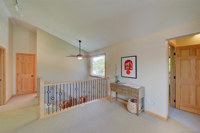 3966 Bosque Ct, Boulder, CO 80301 - hallway with carpet flooring, vaulted ceiling, an upstairs landing, and baseboards