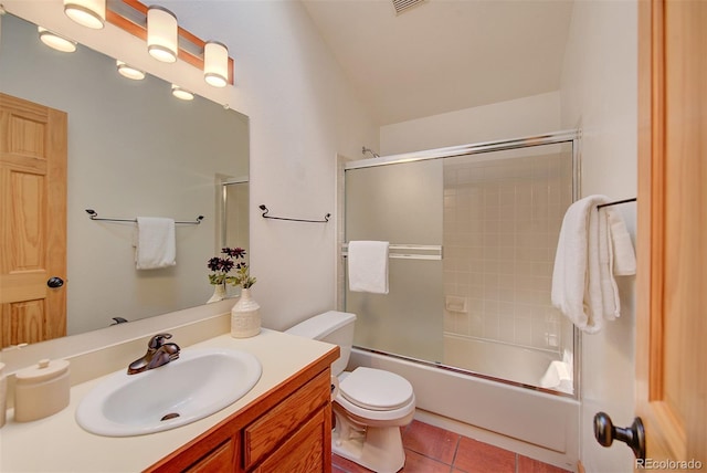 3966 Bosque Ct, Boulder, CO 80301 - bathroom featuring vanity, toilet, tile patterned flooring, combined bath / shower with glass door, and vaulted ceiling