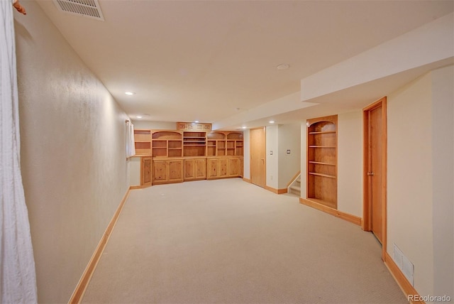 3966 Bosque Ct, Boulder, CO 80301 - finished basement with light carpet, baseboards, stairway, recessed lighting, and built in shelves