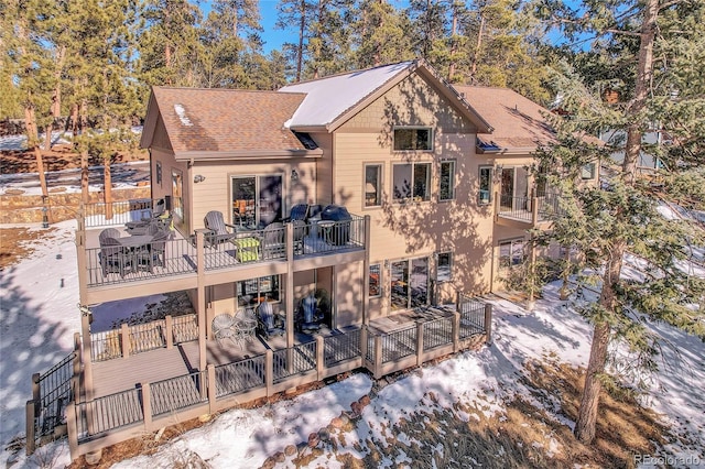 snow covered house with a balcony