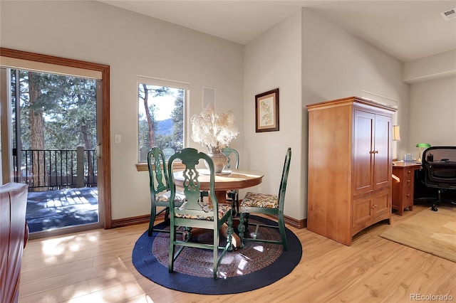 dining space featuring light hardwood / wood-style floors