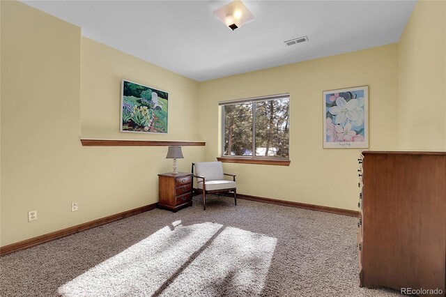 living area featuring light colored carpet