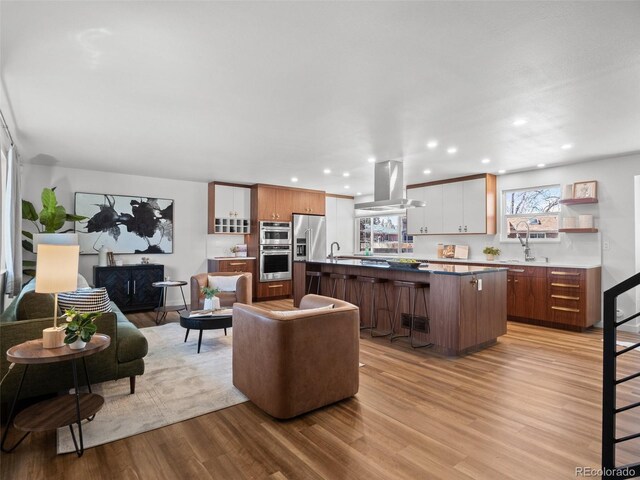 living room featuring recessed lighting and light wood finished floors