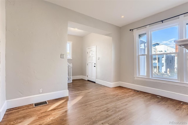 unfurnished room featuring hardwood / wood-style floors