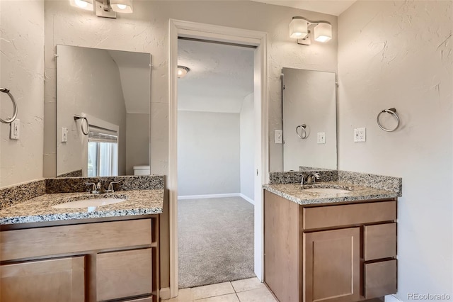 bathroom with vanity, tile patterned floors, and toilet