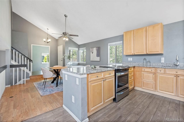 19937 E Loyola Pl, Aurora, CO 80013 - kitchen featuring stainless steel range with electric stovetop, light brown cabinets, wood finished floors, a peninsula, and ceiling fan