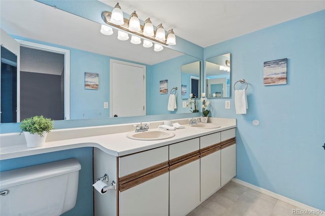 19937 E Loyola Pl, Aurora, CO 80013 - bathroom with double vanity and toilet