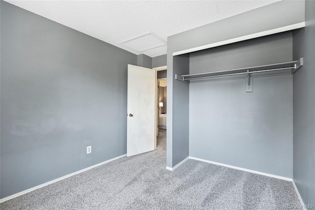 19937 E Loyola Pl, Aurora, CO 80013 - unfurnished bedroom with carpet flooring, attic access, a closet, and a textured ceiling