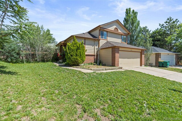 19937 E Loyola Pl, Aurora, CO 80013 - view of front of property featuring brick siding, a front lawn, concrete driveway, a shingled roof, and an attached garage