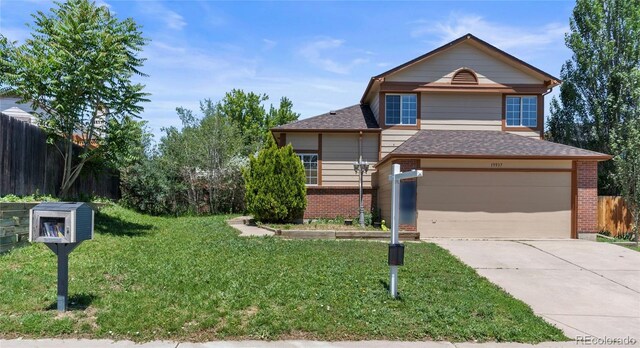 19937 E Loyola Pl, Aurora, CO 80013 - view of front of home with brick siding, a garage, driveway, and roof with shingles