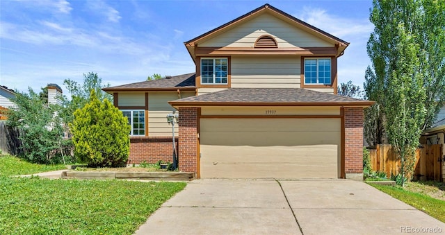 19937 E Loyola Pl, Aurora, CO 80013 - view of front of house featuring brick siding, concrete driveway, a shingled roof, and an attached garage