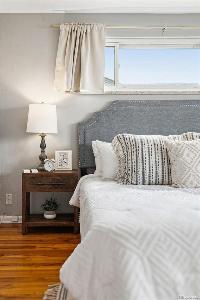 bedroom featuring wood finished floors