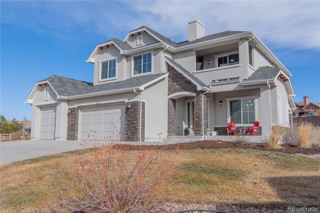 view of front of home featuring a front lawn and a garage