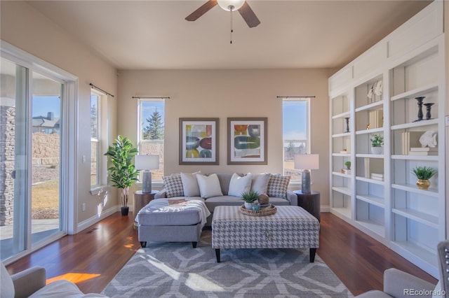 living room with dark hardwood / wood-style floors and ceiling fan