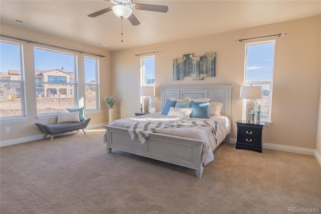 carpeted bedroom with ceiling fan