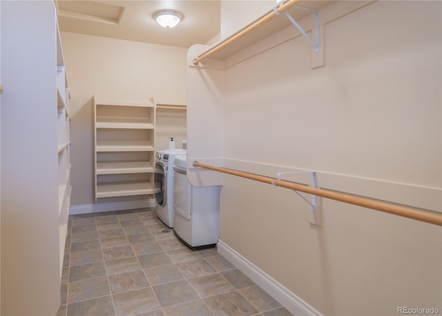 spacious closet with washer and dryer