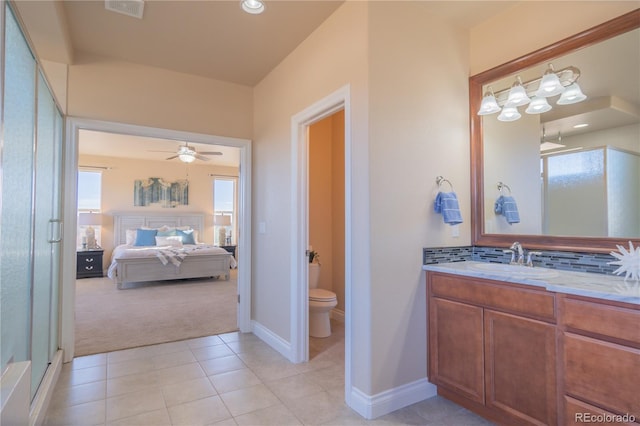 bathroom featuring vanity, tile patterned floors, decorative backsplash, ceiling fan, and toilet