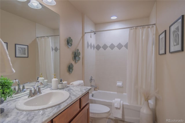 full bathroom featuring vanity, shower / bath combo, and toilet