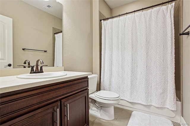 full bathroom with toilet, vanity, visible vents, tile patterned floors, and shower / bath combo with shower curtain