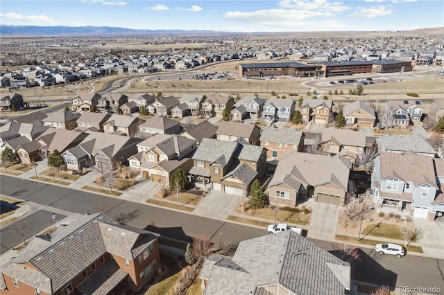 birds eye view of property with a residential view and a mountain view