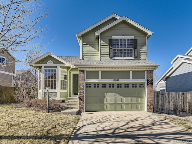 traditional home featuring roof with shingles, fence, concrete driveway, and brick siding