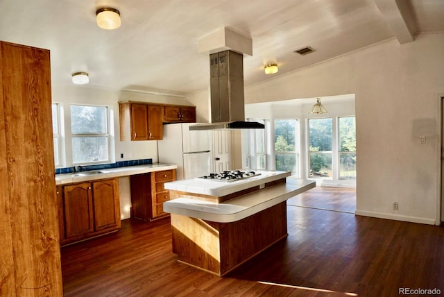 kitchen featuring lofted ceiling with beams, island exhaust hood, plenty of natural light, and dark wood-type flooring