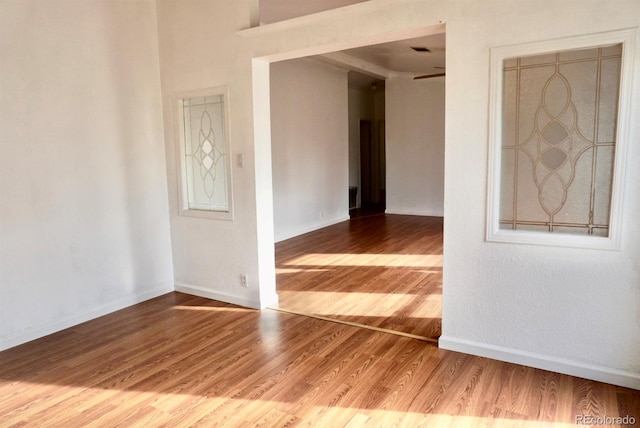 empty room with hardwood / wood-style floors