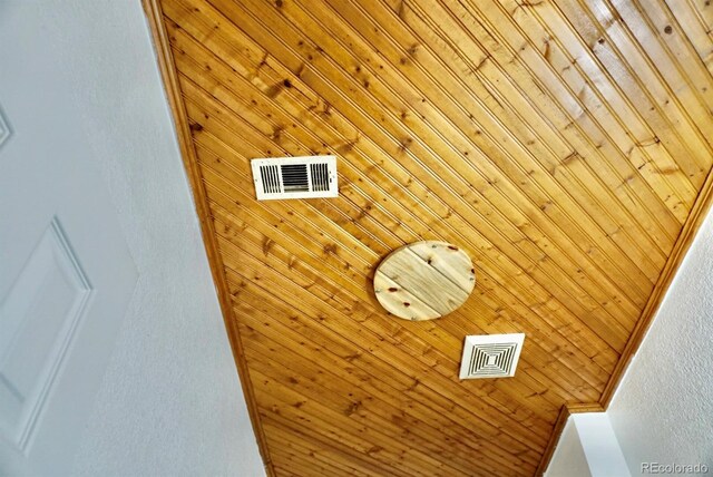 details featuring wood walls and crown molding