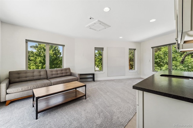 2564 S Carey Way, Denver, CO 80222 - living room with recessed lighting, light colored carpet, and baseboards